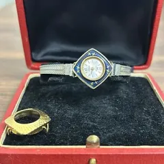 KOMPLE GÜMÜŞ KORDONLU ALTIN MİNELİ KURMALI KADIN KOL SAATİ